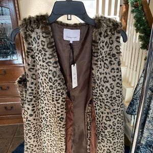 Symphony and Note faux fur vest